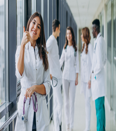 https://spotlightresearchcenter.com/wp-content/uploads/2023/05/young-female-doctor-with-thumbs-.jpg